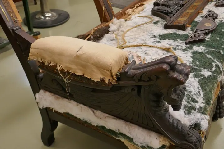 All of the original seating materials were changed yet much of the original upholstery was left intact.