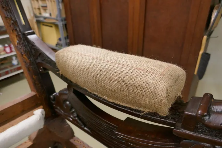 Spanish moss stuffed into a bun, marked out for stitching.
