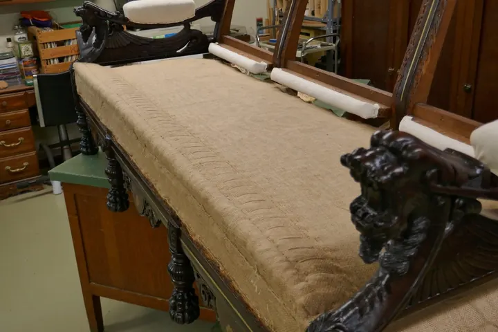 Wood wool filled stitched edge roll.