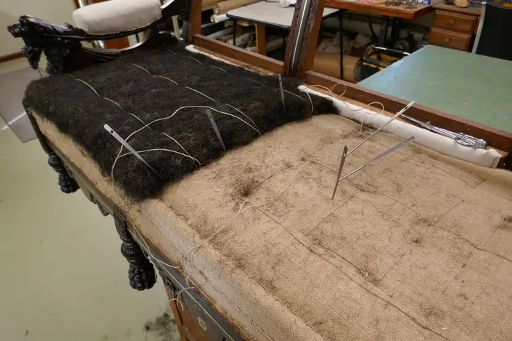 Putting down mat of restored original 140 year-old horse hair.