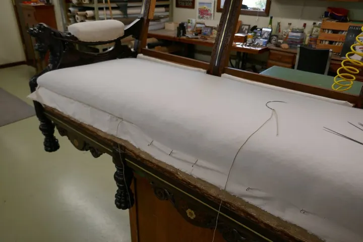 Stitching muslin over hair pad.