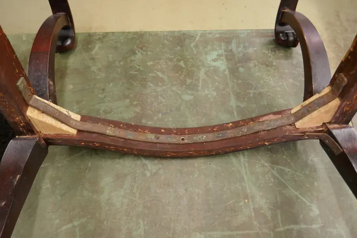 Serious frame damage was hiding undercover. A steel brace was screwed into place to hold the frame together.