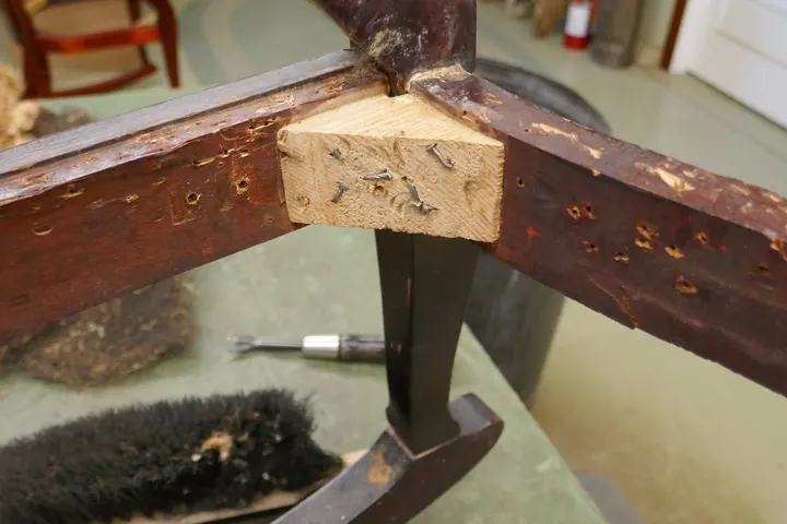 Corner braces were brutally nailed causing further damage.