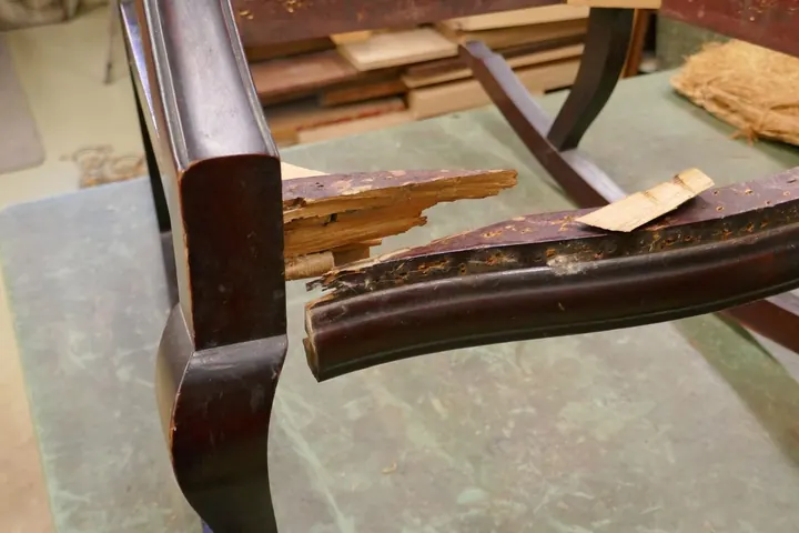 The front rail was shattered into several pieces with a large piece missing.