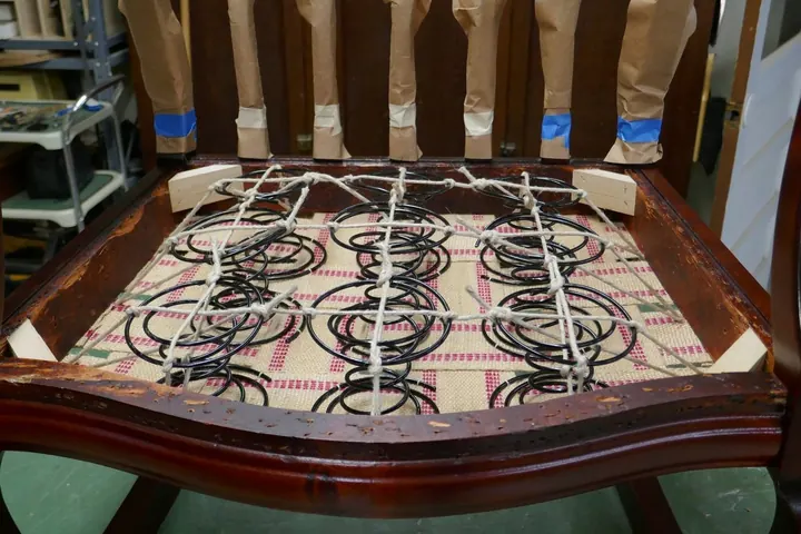 Original ties were tacked to the inside rails, which is very difficult and prone to failure. I opted to pull my ties to the bottom of the rails.