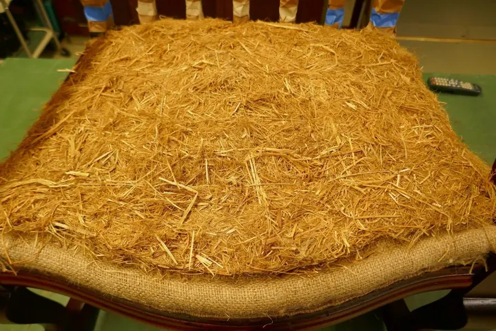 I left the original straw intact and placed it over the new foundation, then stitched it into the burlap.