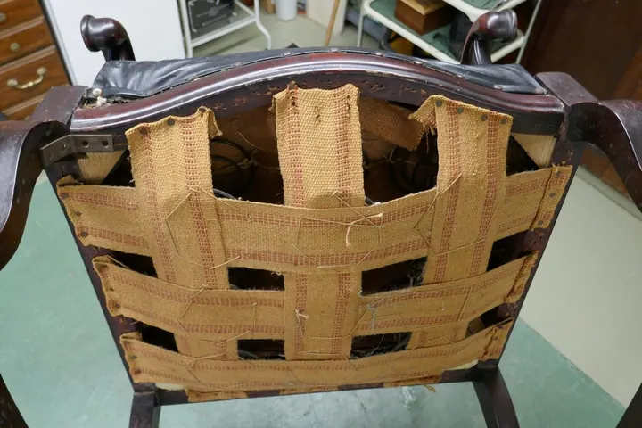 Webbing had been replaced with original spring tying left in place.