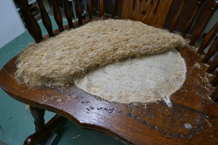 Salvaged 100+ year-old flax straw-tow layered firmly at 1" thickness.