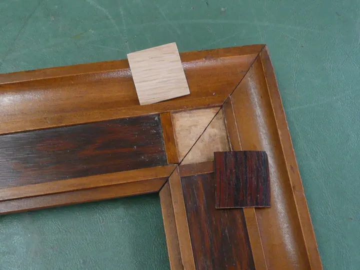 Additional veneer was added to the corner to even thickness to the original.