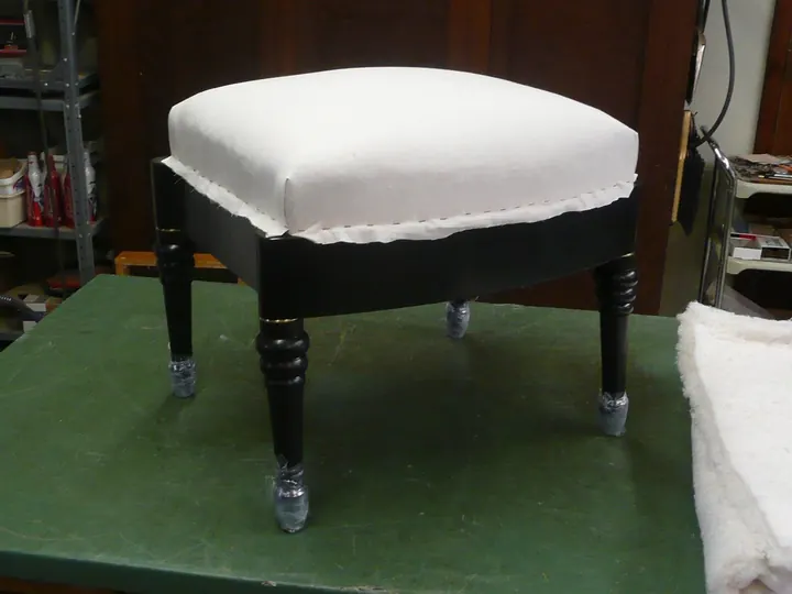 Stuffing materials pulled into shape with muslin.