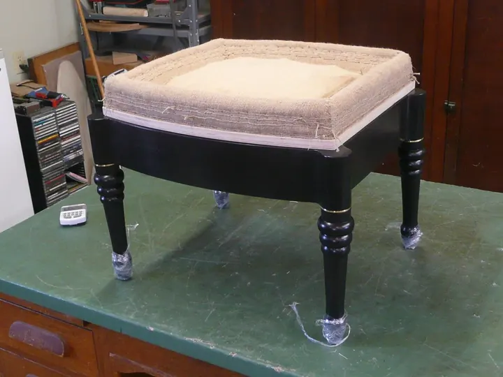 Seen here with the short legs that unscrew at the brass ring above the lathe turning.