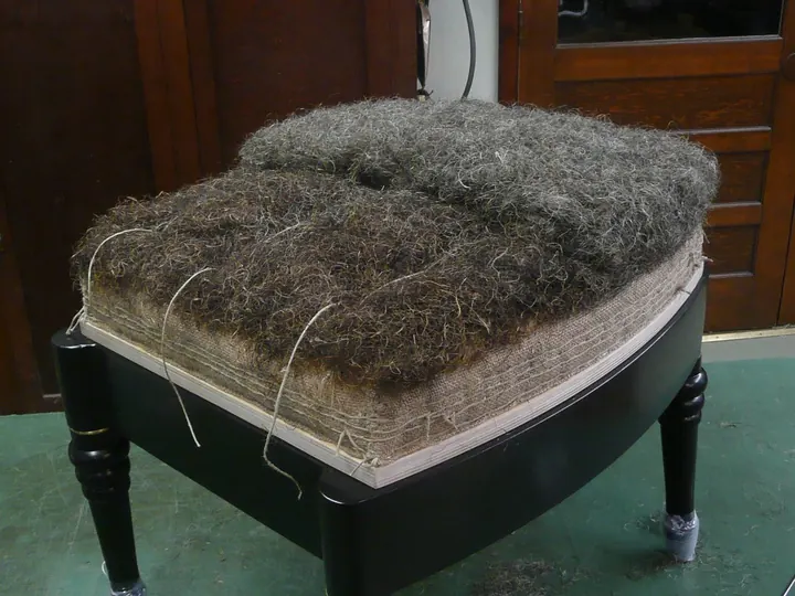 I added an inch of curled horse hair to soften the underlying fibers.
