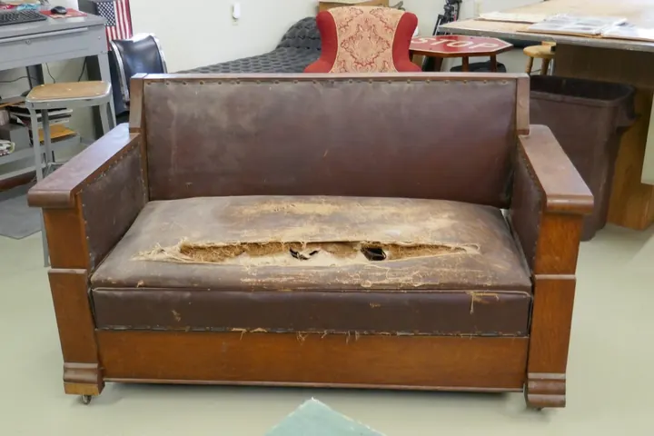 Sofa-bed on arrival in original condition. Best described as a "barn find" in dirty, rusty condition.