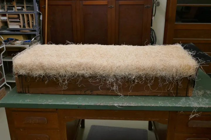 Wood wool in place, ready for a topping of cotton.